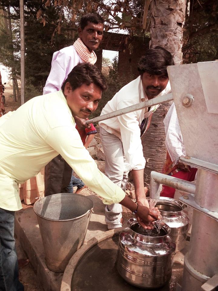 Men around well India