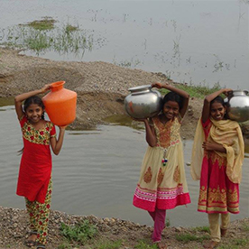 Indian girls carrying water