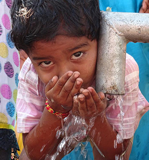 Indian child drinking water